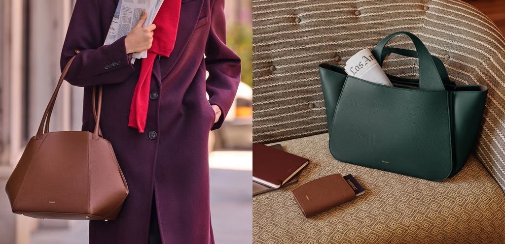 Person holding a large handbag and a newspaper next to an armchair with a handbag and papers.