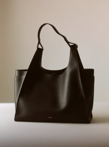 Large tote bag with clean design on surface.