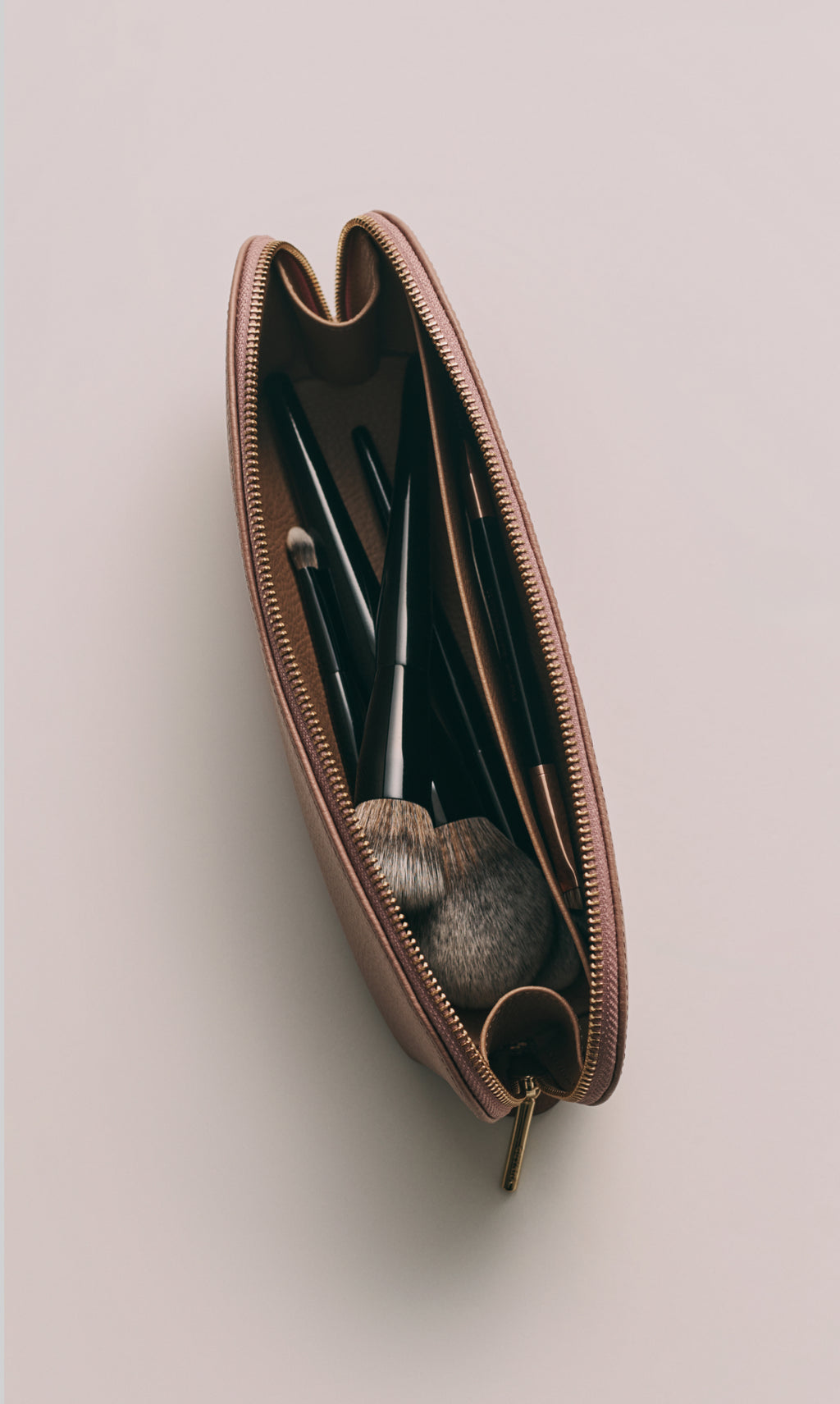 Makeup brushes in a zippered pouch