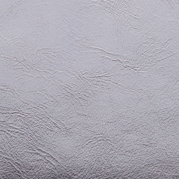 Textured surface with visible patterns and lines.