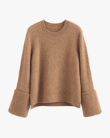 Knit knit sweater with wide cuffs, and a ribbed crew neckline.