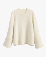 A long-sleeve sweater with wide cuffs and a ribbed neckline.