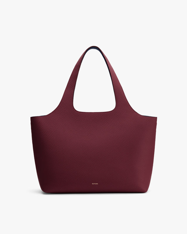 A large tote bag with a wide opening and two handles.