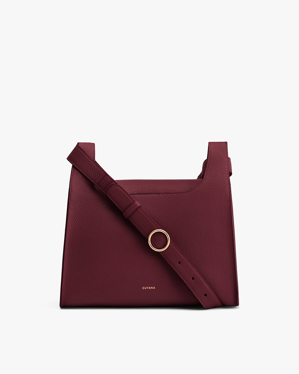 Square shoulder bag with a round buckle on the strap.