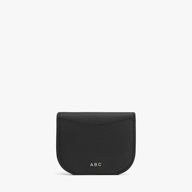 Small leather pouch with initials ABC on the front.