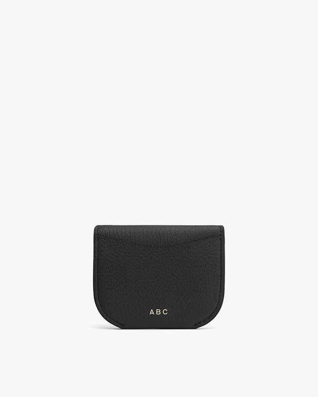 Small leather pouch with initials ABC on the front.