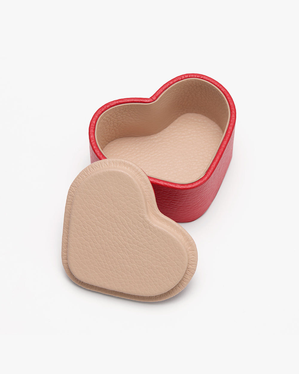 Heart-shaped box with lid placed beside it