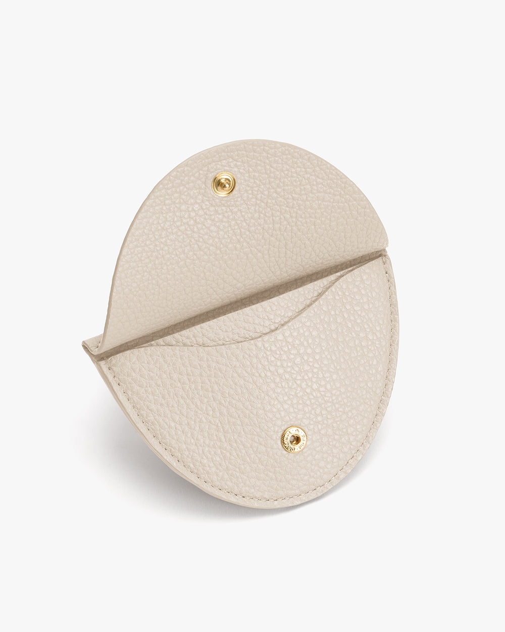 Round textured leather coin pouch with snap closure.