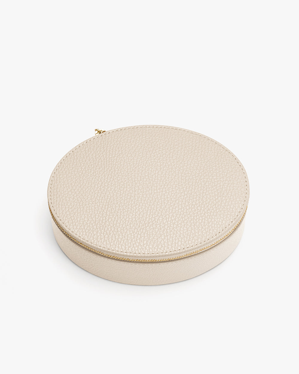 Round textured storage case with zipper closure.