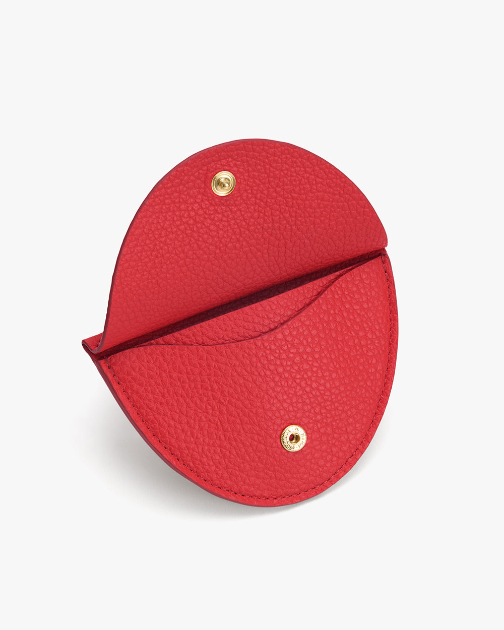 Open round coin purse with snap buttons.