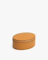 Oval-shaped leather case with a zipper.