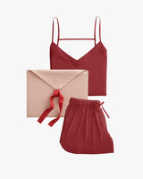 Sleeveless top with matching shorts and envelope-style pouch with ribbon.