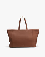 Large tote bag with handles on a plain background.