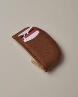 Small wallet with zipper and cards peeking out