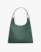 Handbag with a wide handle and structured design