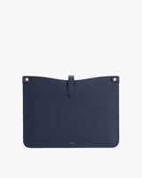 Rectangular pouch with a snap buttons and a tab closure at the top center.