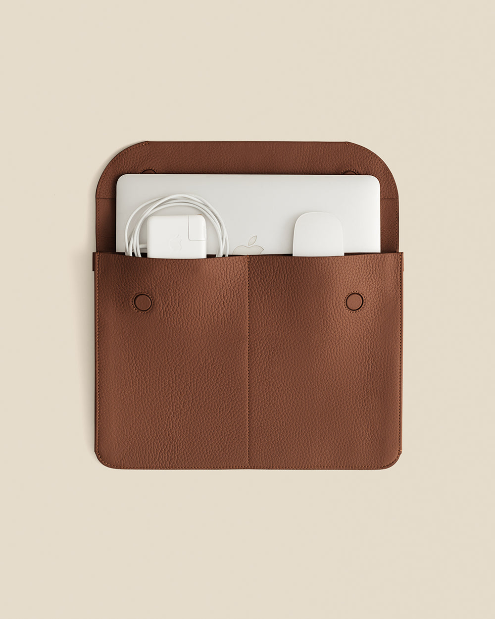 Laptop sleeve with charger and device inside.