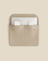 Open laptop sleeve with laptop and cable inside.