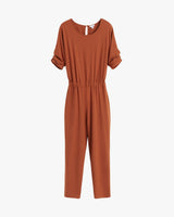 Jumpsuit with rolled-up sleeves and an elastic waist.