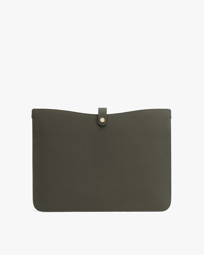 Leather clutch purse with flap closure.