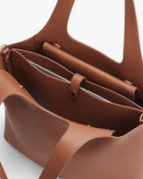 Close-up of an open handbag showing internal compartments