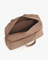 Open travel bag with handles and a zippered main compartment.