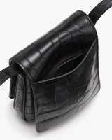 Handbag with a textured pattern and shoulder strap.