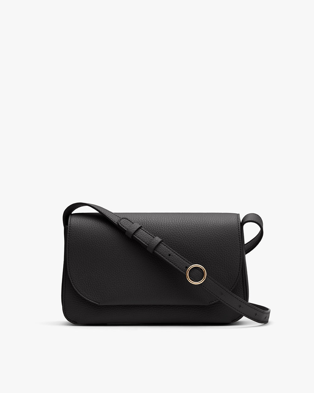 A handbag with an adjustable strap and a circular clasp.