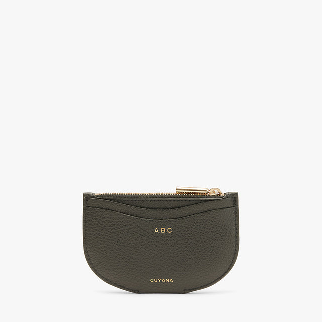 Small zippered pouch with initials ABC on front.