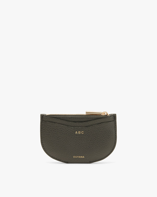 Small zippered pouch with initials ABC on front.