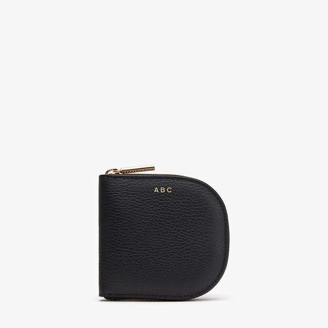 Small purse with zipper and initials ABC on front.