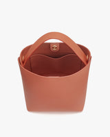 Handbag with top handle and interior pocket