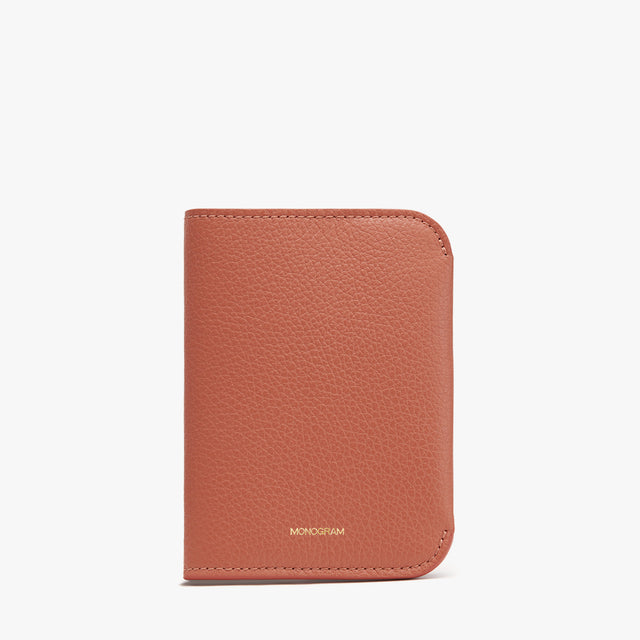 Leather wallet standing upright on a plain background.