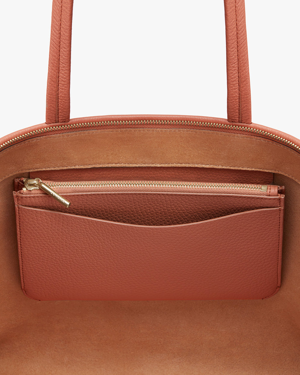 Handbag with top zipper and an outer pocket.