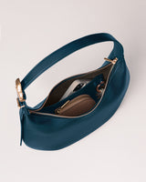 Handbag with a visible phone and wallet inside.