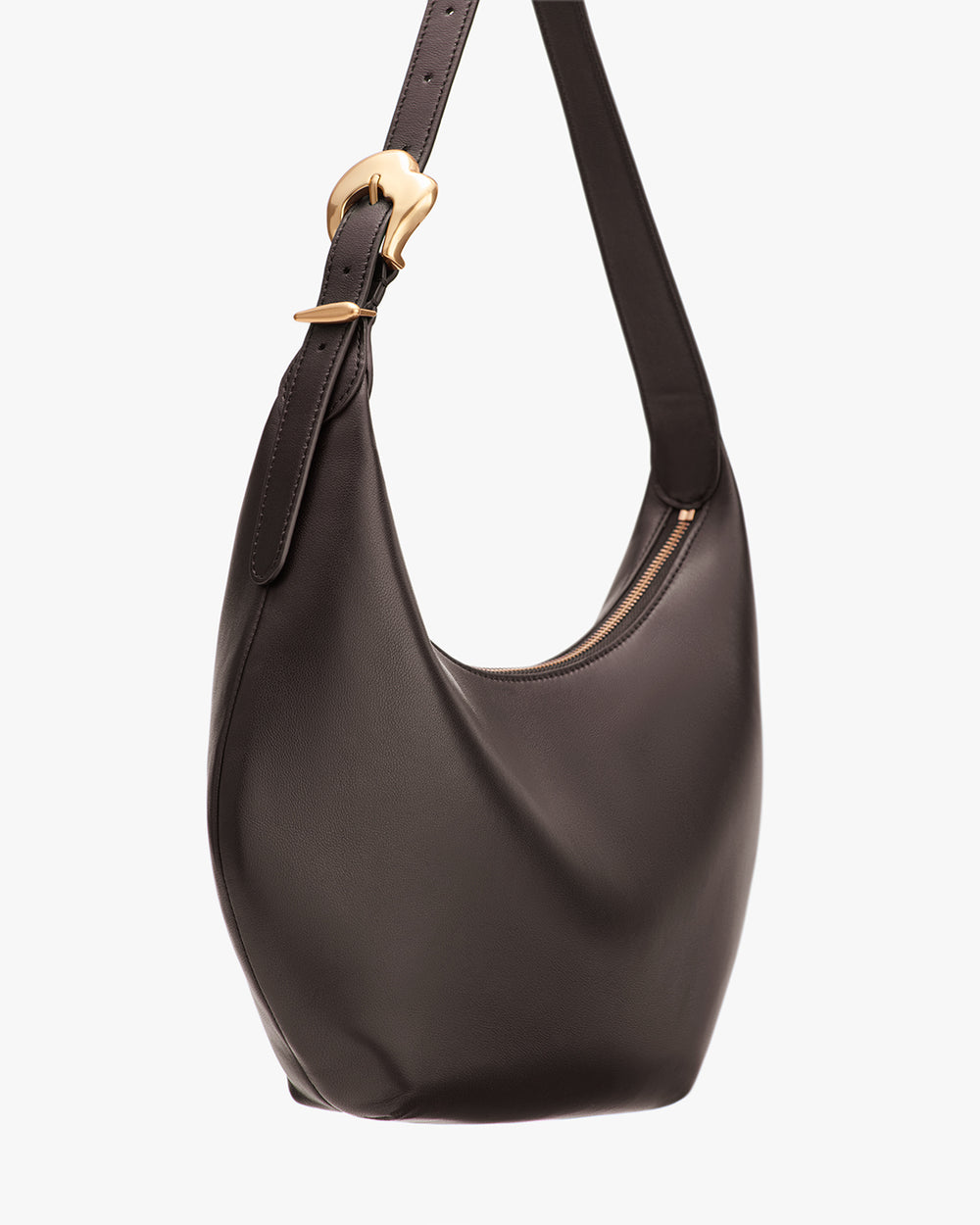 A crescent-shaped shoulder bag with a gold buckle on the strap and a zipper closure.