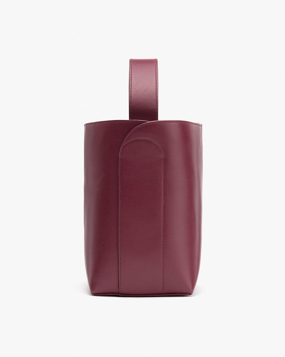 Small cylindrical leather tote with a single loop handle.