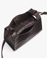 Small bag with a strap and croc-embossed leather.