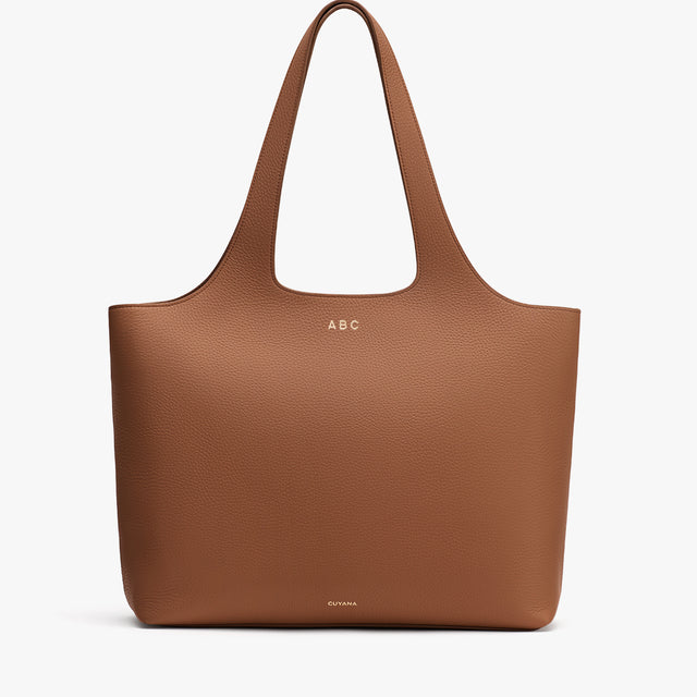 Large tote bag with two handles and minimal design.