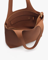 Open handbag with visible interior compartments and a zipper pocket.