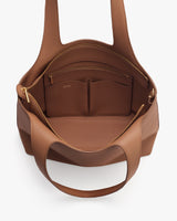 Open handbag showing interior compartments and pockets