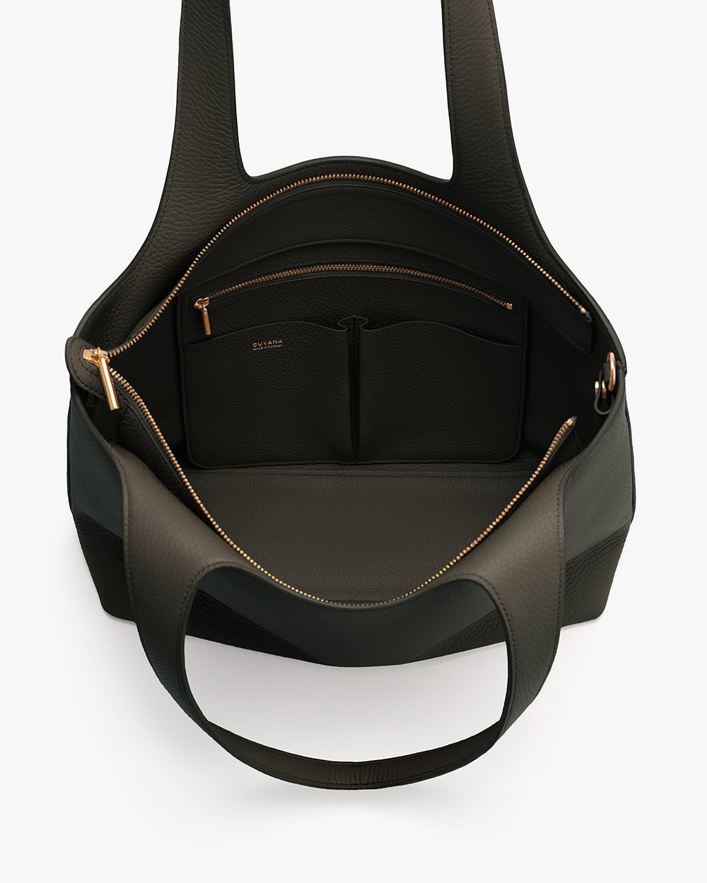 Open handbag with visible interior pockets and zippers