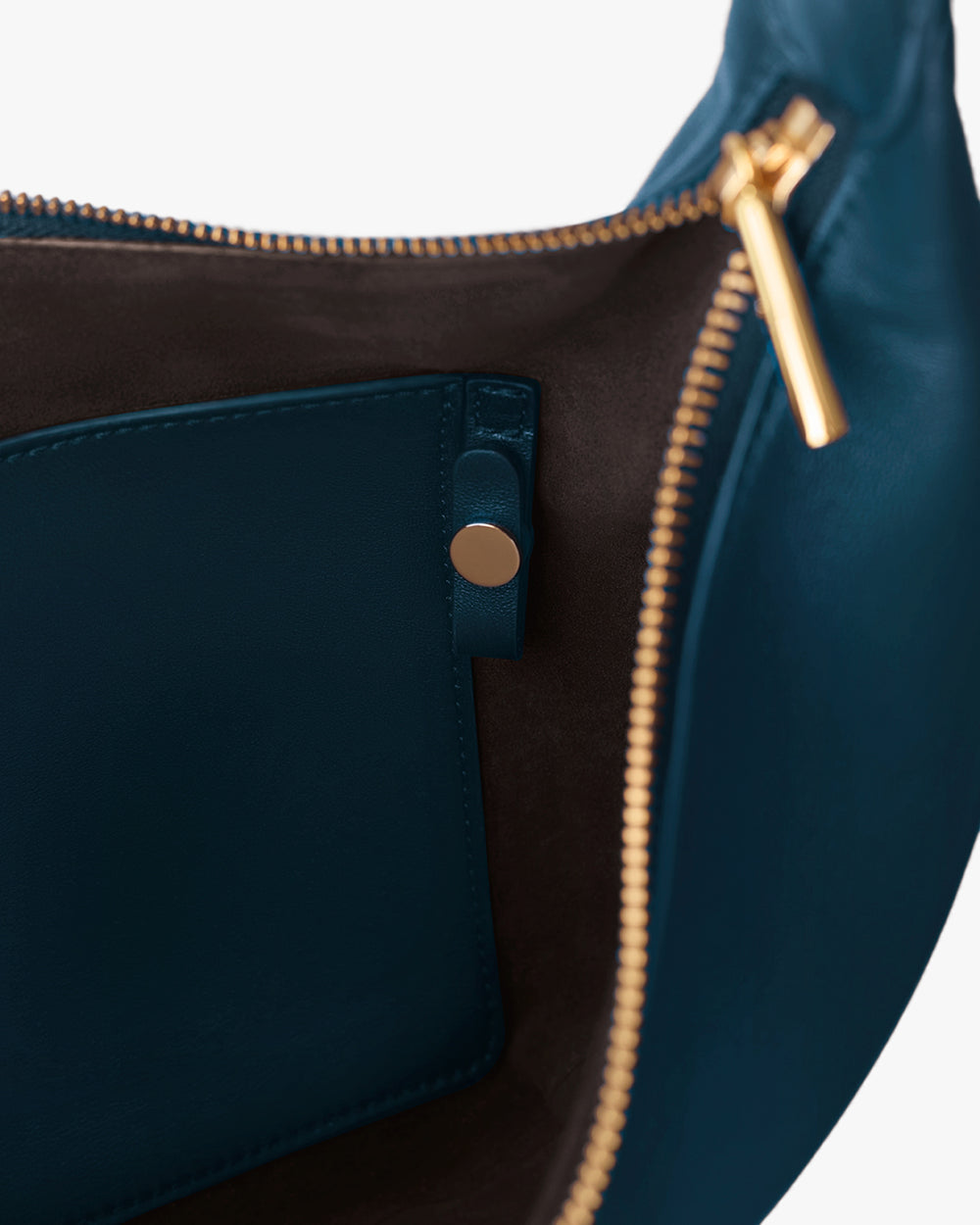 Bag interior with pocket and zipper pull visible.