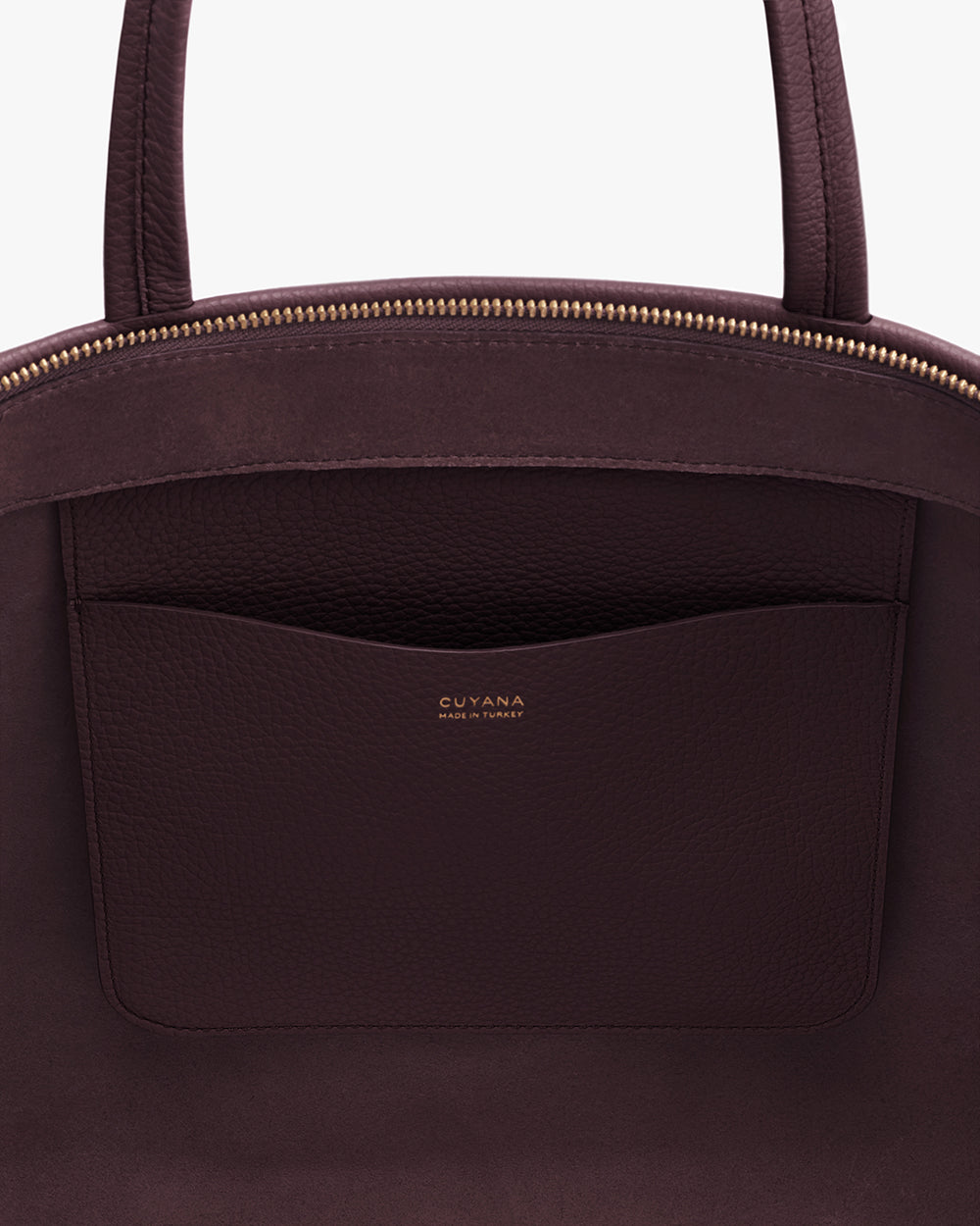 Open handbag with visible interior pocket and zipper.
