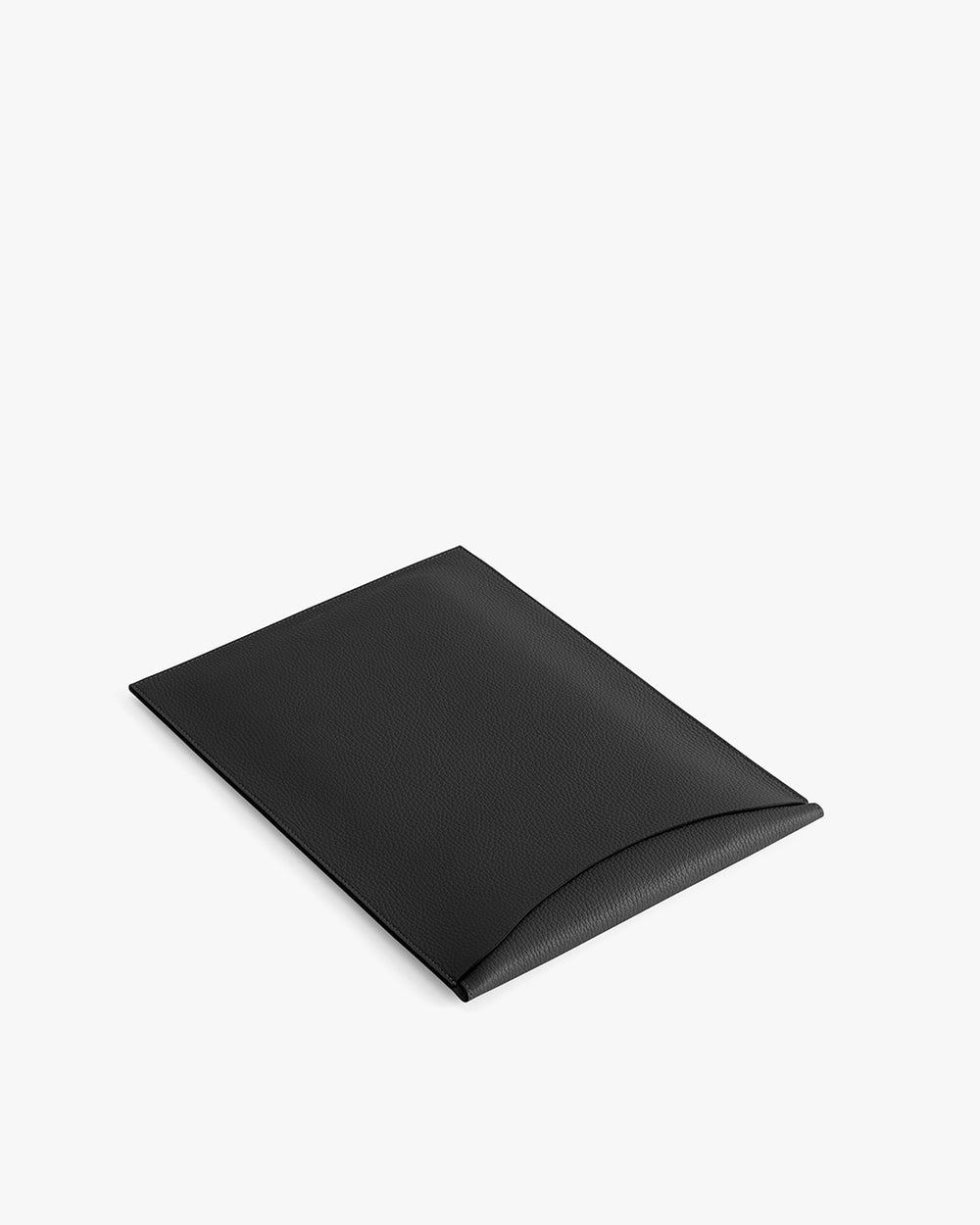 Rectangular laptop sleeve with a slightly open flap on flat surface.