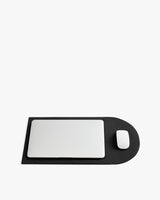 Laptop and mouse on a rectangular mat with a rounded end