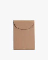 Rectangular leather laptop sleeve bag with a flap closure.