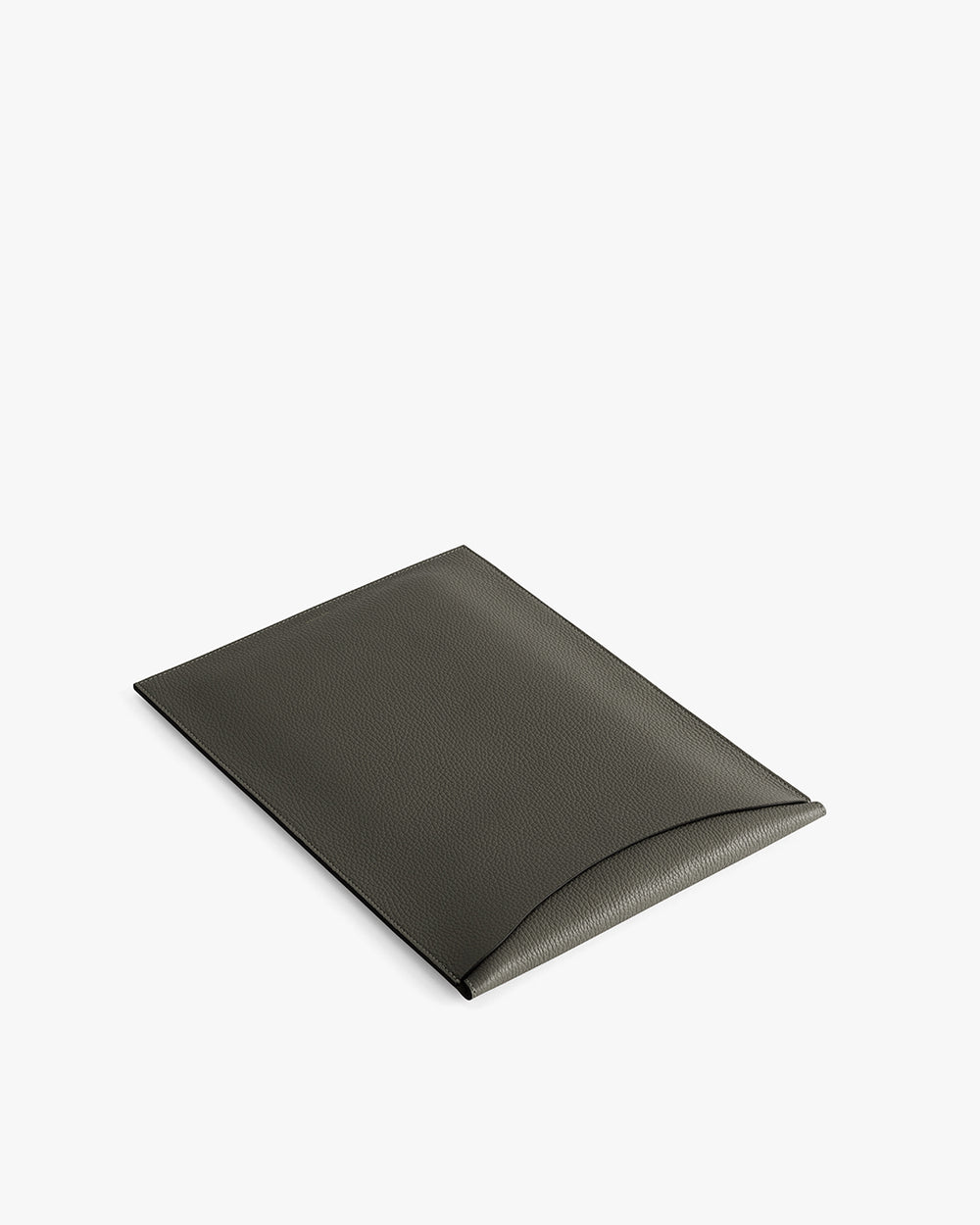 Rectangular leather laptop sleeve with a curved flap closure.