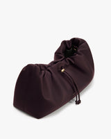 Ruched handbag with drawstring closure.