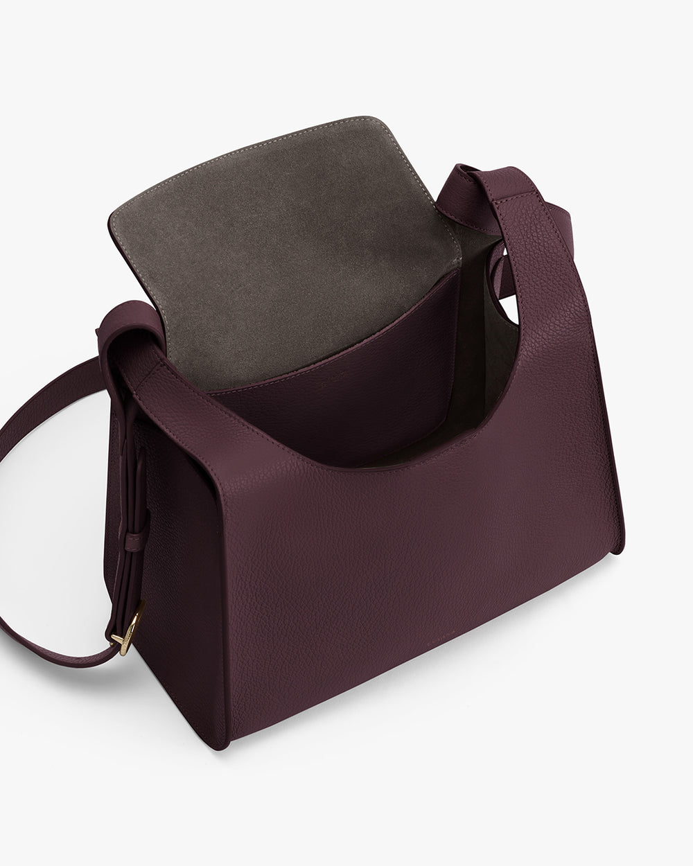 Open purse with a strap displayed on a plain background.